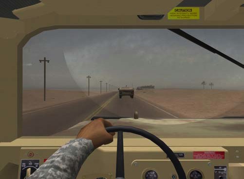 Driving humvee along dusty road